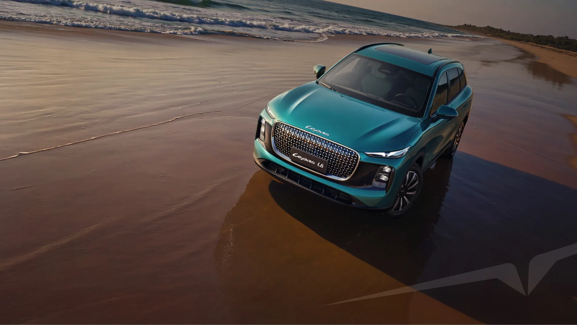 Teal Lepas L8 SUV driving along a wet beach at sunset.