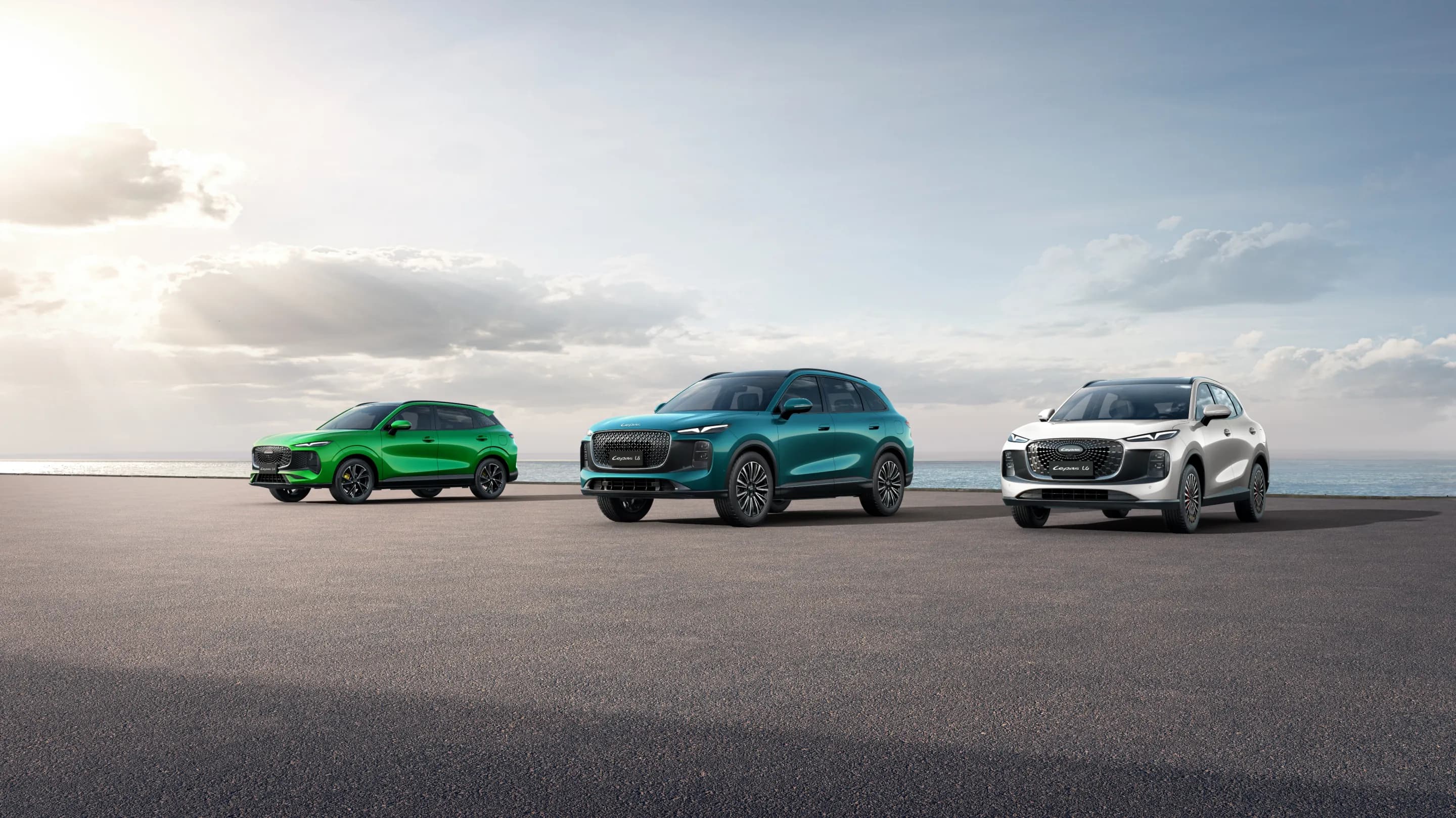 Lepas L4, L6 and L8 smart SUVs parked by the sea under a bright sky